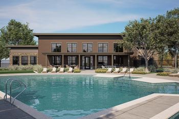 Swimming pool with lounge chairs and clubhouse building